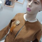 Tasseled brooch