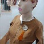 Tasseled brooch